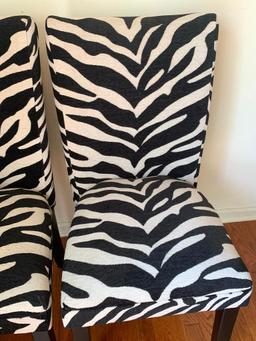 Pair of Zebra Print Accent Chairs. They are 39" T x 17" W - As Pictured