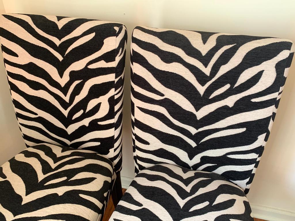 Pair of Zebra Print Accent Chairs. They are 39" T x 17" W - As Pictured