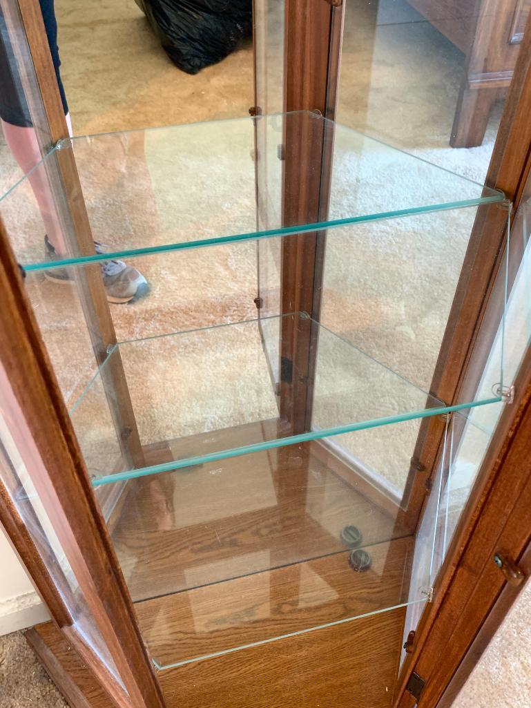 Oak Curio Cabinet w/Lights & 4 Glass Shelves by Palaski Furniture. This is 71" T x 19" W