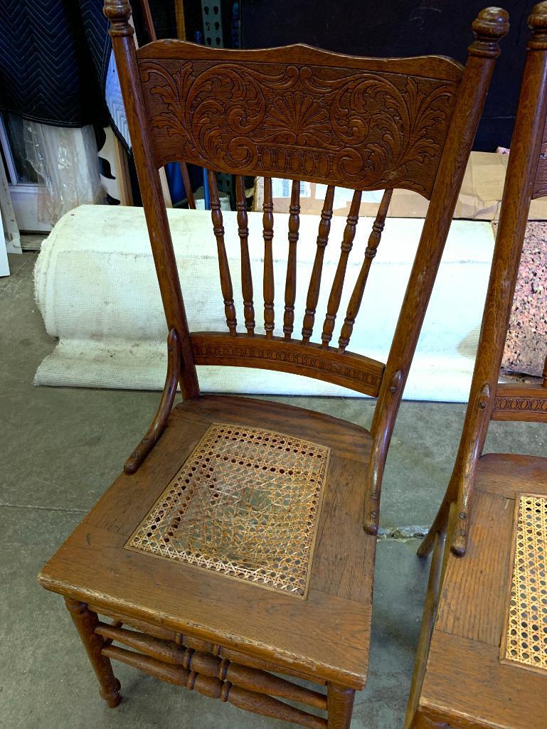 Pair of Cane Bottom Dining Chairs. They are 41" Tall - As Pictured
