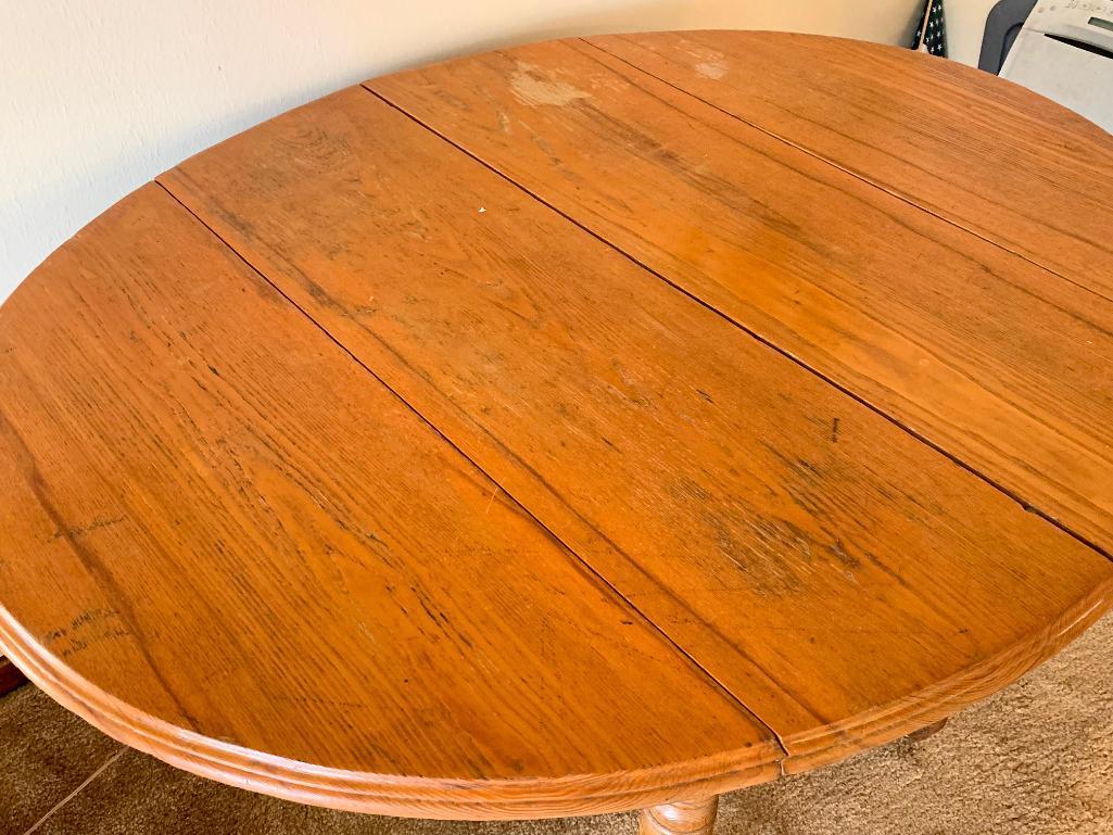 Drop Leaf Dining Table w/2 Leafs. This is 29" T x 52" L x 40" W. Has Scratches from Use