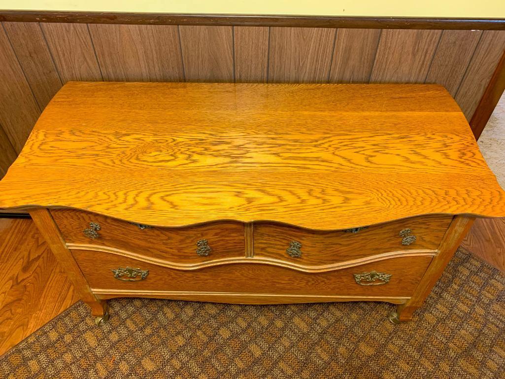 3 Drawer Antique Oak Serpentine Front Low Boy Dresser on Casters. This is 25" T x 44" W x 20" D