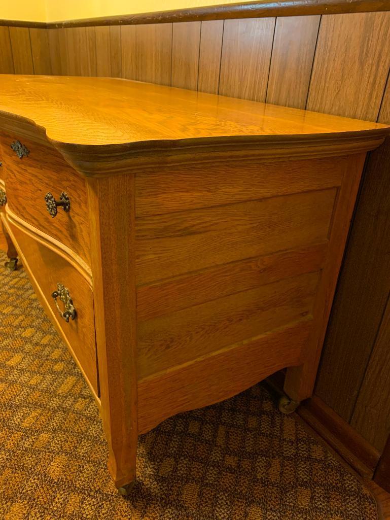 3 Drawer Antique Oak Serpentine Front Low Boy Dresser on Casters. This is 25" T x 44" W x 20" D