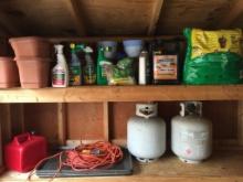 Two Shelf Lot in Shed Incl Drip Pans, Two Full Propane Tanks and Gardening Supplies