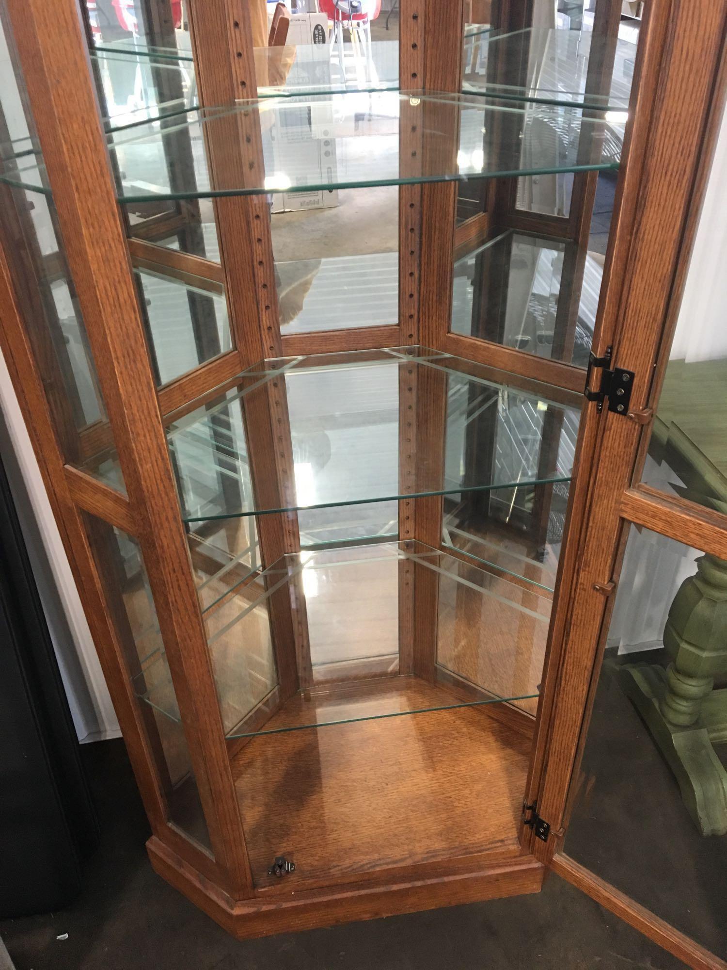 Lighted/mirrored corner curio cabinet