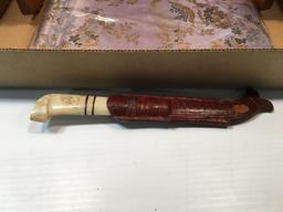 Hunting knife, tapestry, book ends, more