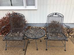 2- wrought iron chairs and table