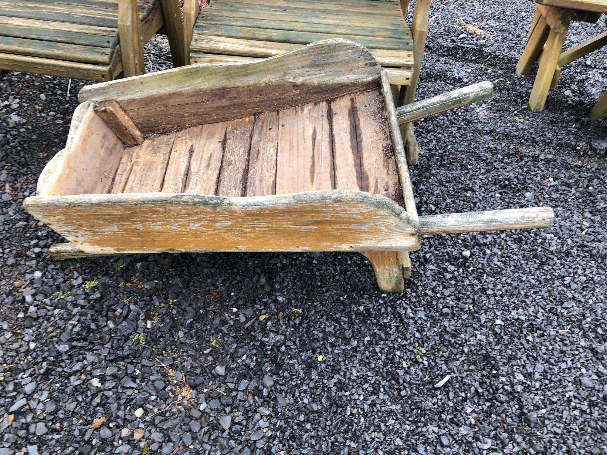 2 wooden outdoor rocking chairs,wooden decorative outdoor wheel barrel(needs front tire)