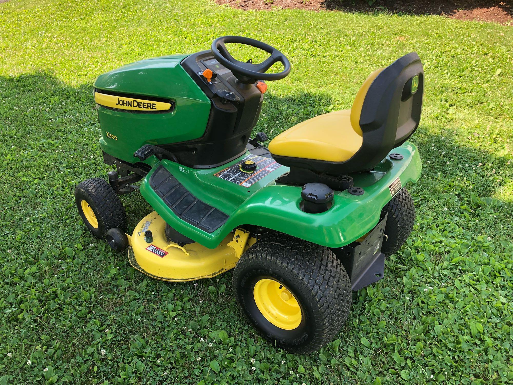 JOHN DEERE(X300) lawn tractor/42" mower deck in running condition showing only 172 hours of run time