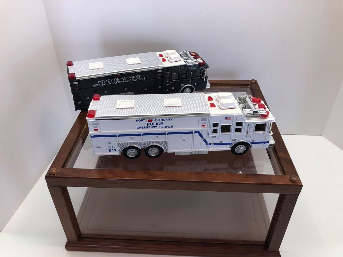 2 plastic replica Emergency trucks/display case