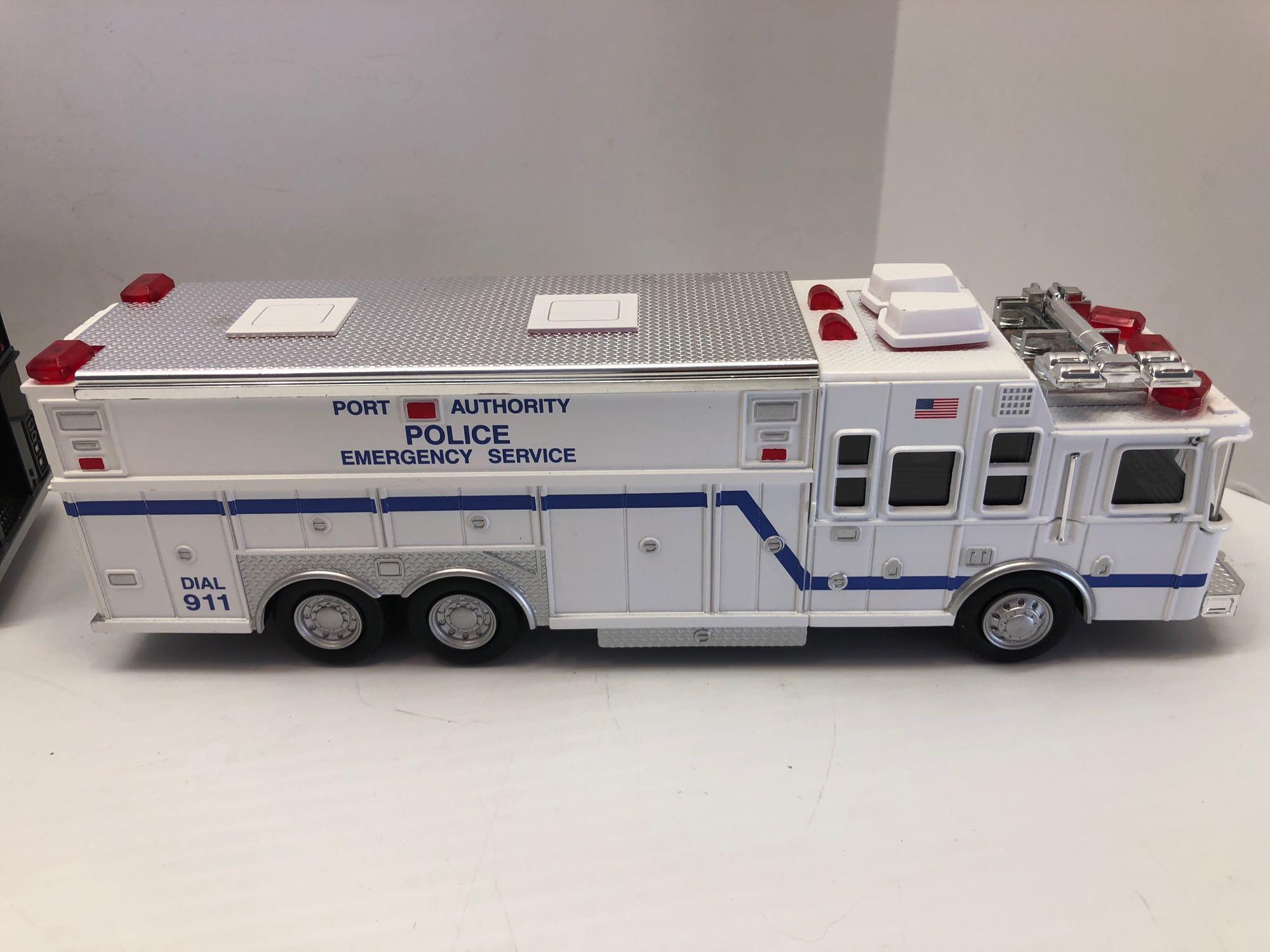 2 plastic replica Emergency trucks/display case