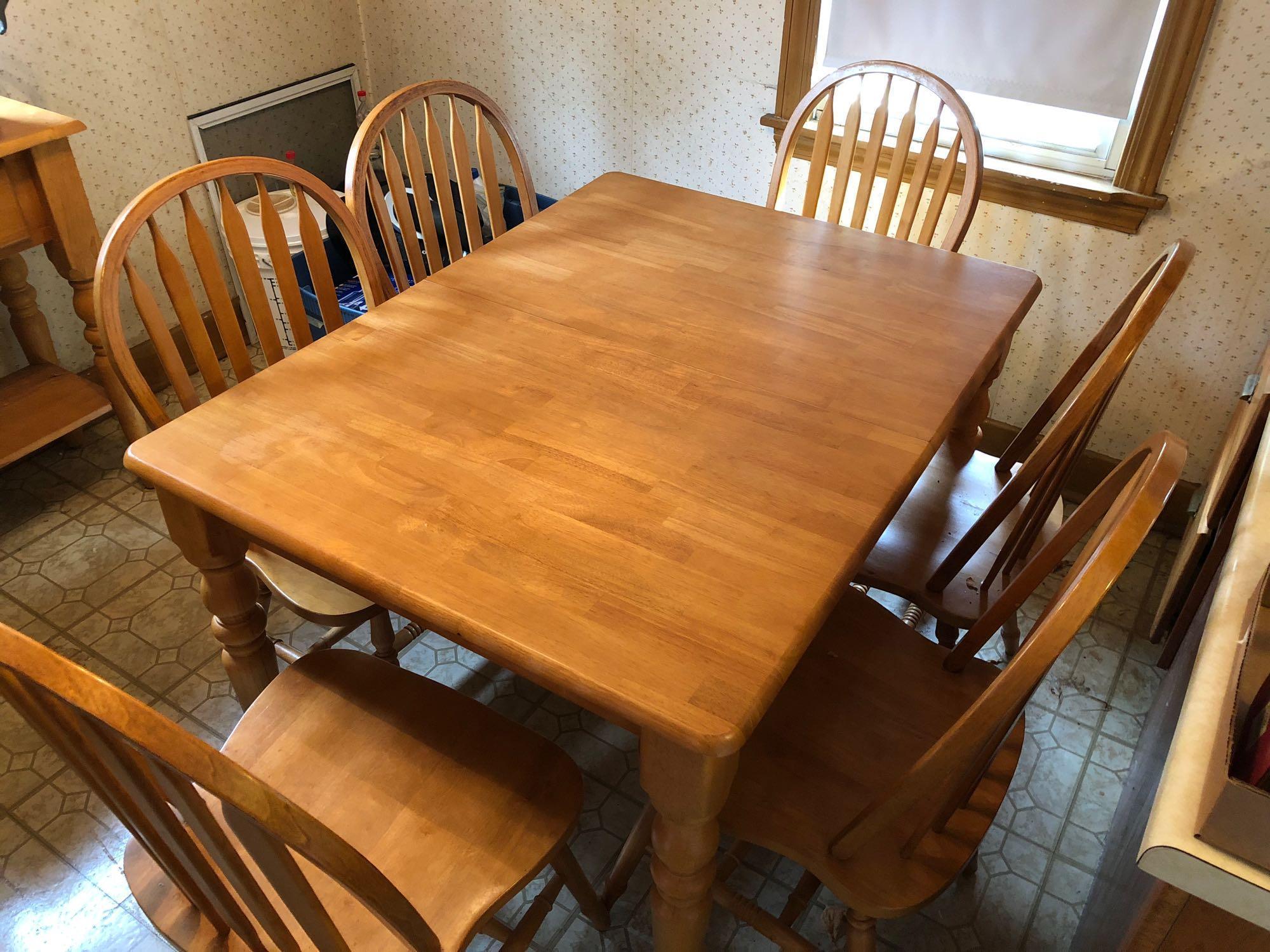 Hardwood(Maple?)kitchen table with 6 matching chairs and pop up leaf extension(Matches lot 41)