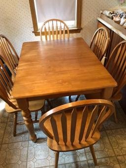 Hardwood(Maple?)kitchen table with 6 matching chairs and pop up leaf extension(Matches lot 41)