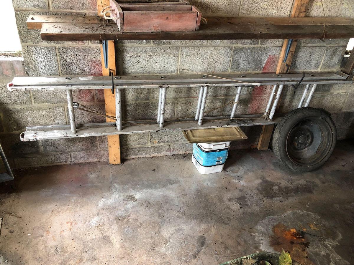 Aluminum extension ladder, spare tire (as is)