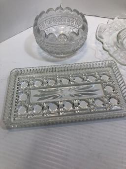 Glass plates, creamer, sugar, candlestick holders, more