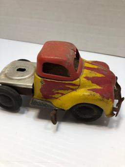 Yellow and red tin toy