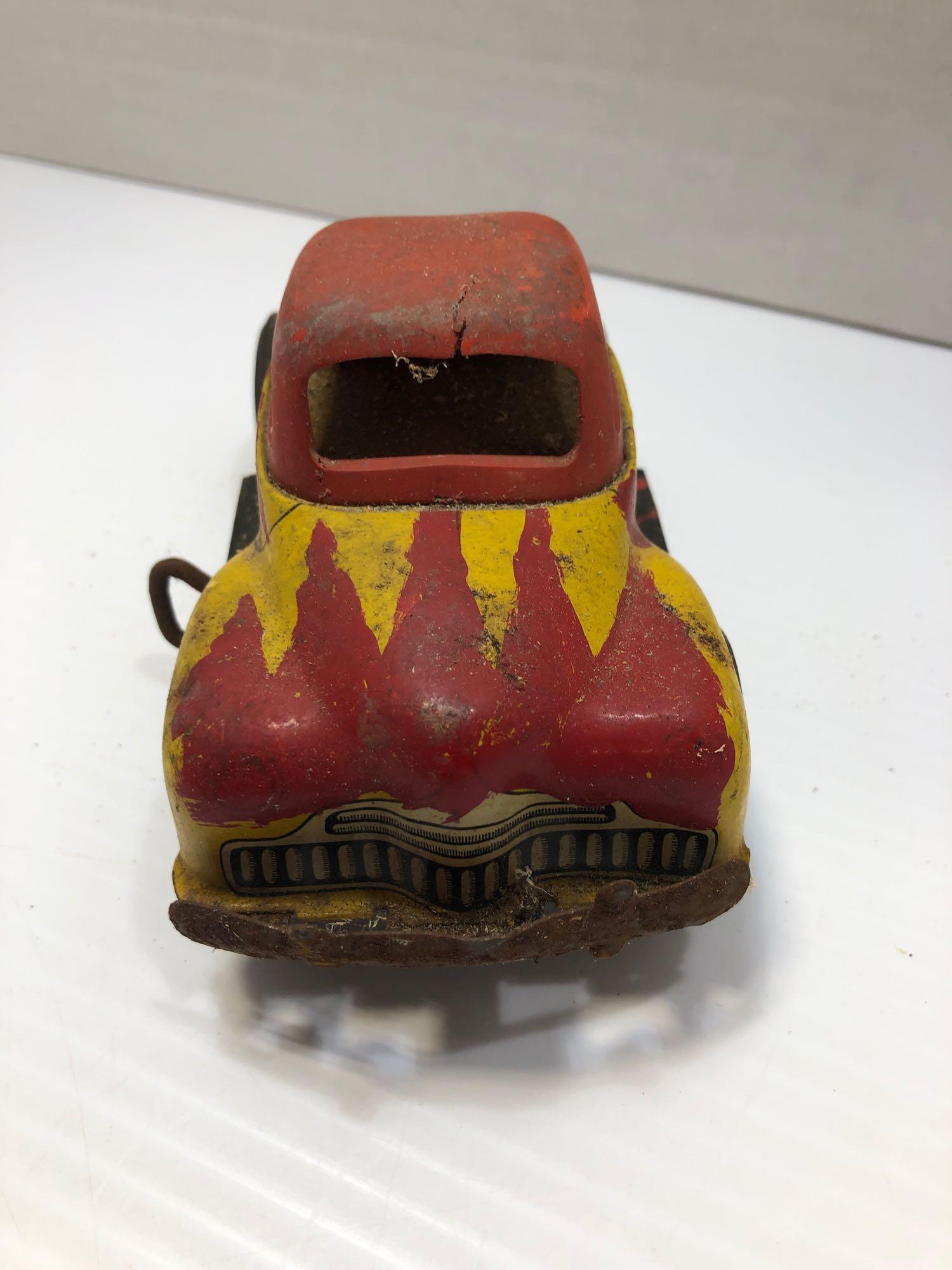 Yellow and red tin toy