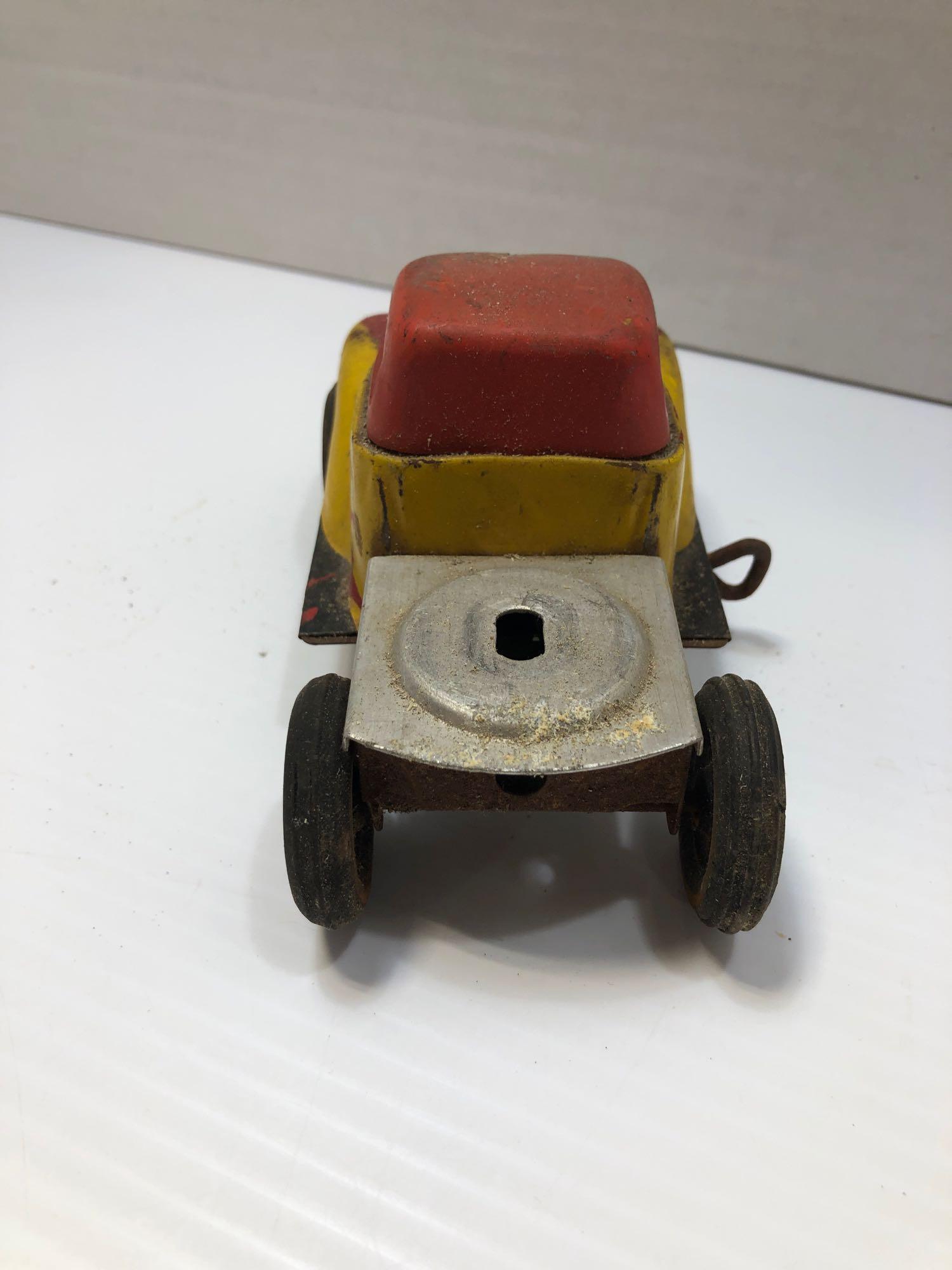 Yellow and red tin toy