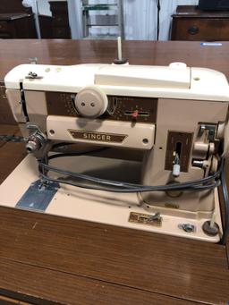 Singer cabinet sewing machine with leaf extension nice condition