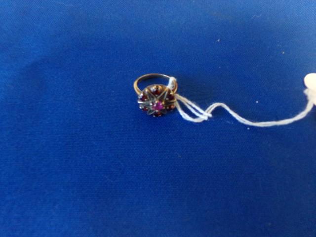 10KT YELLOW GOLD RING WITH 7 RED RUBY TYPE STONES (2.2 DWT)