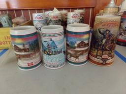 COLLECTION OF FOUR MILLER BEER STEINS