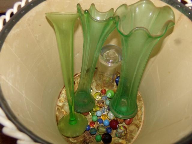 VINTAGE WASTE BASKET WITH GREEN GLASS BUD VASES AND ANTIQUE MARBLES AND SHO