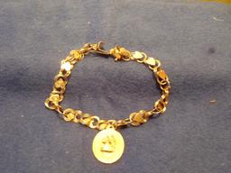 14 KT GOLD BRACELET WITH 14 KT CHARMS 7.7 DWT