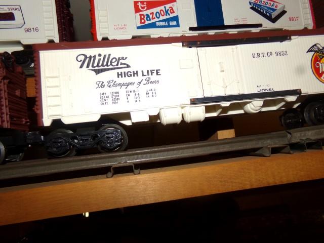 SET OF SIX LIONEL CARS INCLUDING PERRIER 9814 BUDWEISER 9850 SHLITZ 9851 MI