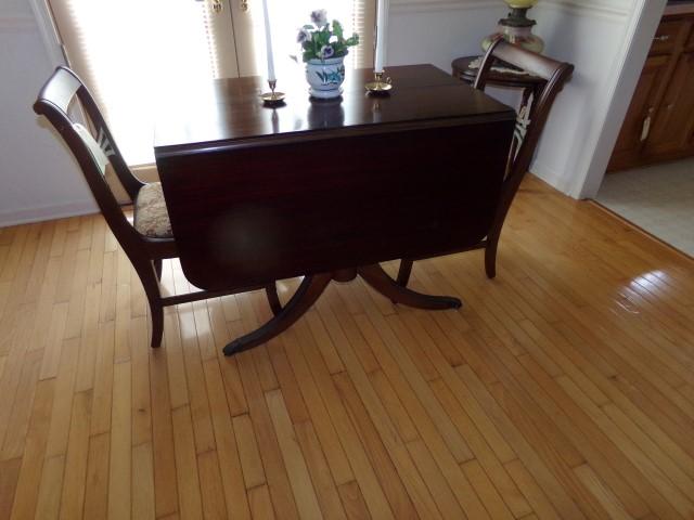 WALNUT DROP LEAF DINING TABLE WITH BRASS CAP FEET AND TWO MATCHING CHAIRS A