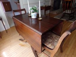 WALNUT DROP LEAF DINING TABLE WITH BRASS CAP FEET AND TWO MATCHING CHAIRS A