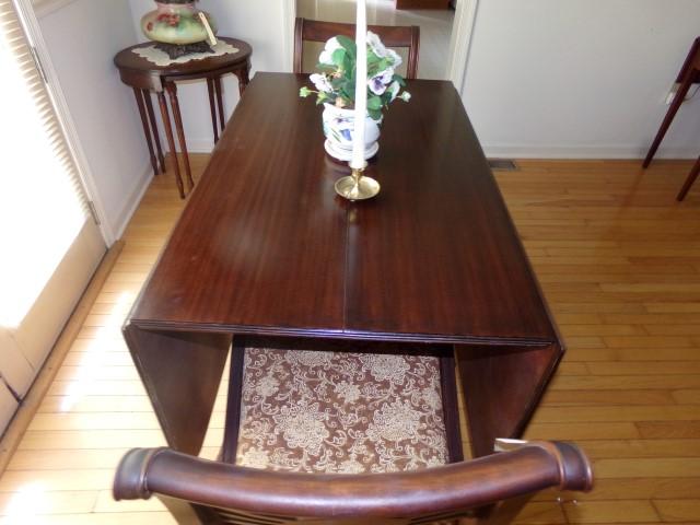 WALNUT DROP LEAF DINING TABLE WITH BRASS CAP FEET AND TWO MATCHING CHAIRS A