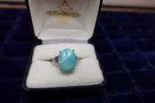STERLING RING WITH TURQUOISE COLOR STONE .16 T OZ