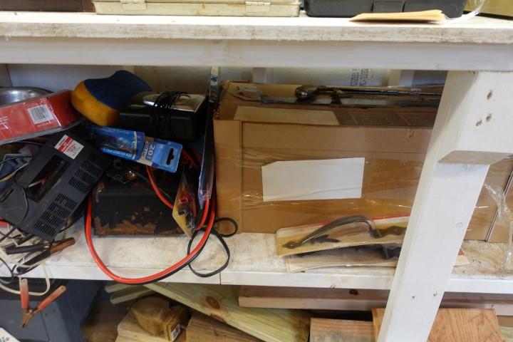 MIDDLE SHELF OF SHED INCLUDING TOOL BOXES VISES BATTERY CHARGER PAINTING SU