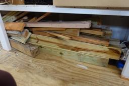 BOTTOM SHELF OF SHED INCLUDING EXTENSION CORDS OLD BOTTLES TOOLS LANTERN AN