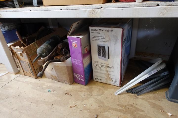 BOTTOM SHELF OF SHED INCLUDING EXTENSION CORDS OLD BOTTLES TOOLS LANTERN AN