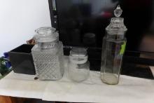 THREE CLEAR GLASS CANISTERS