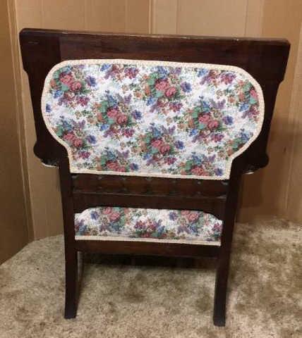 Antique Upholstered Arm Chair with Ornately Carved