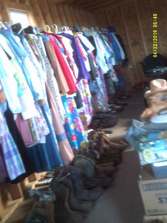 CLOTHES AND MISC ITEMS INSIDE STORAGE BUILDING