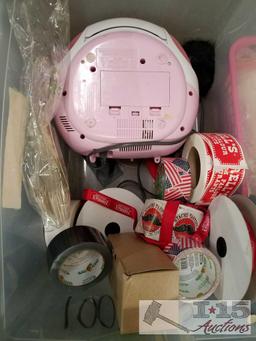 Two bins of miscellaneous items stickers from Farrell's children's clothes farm animals radio