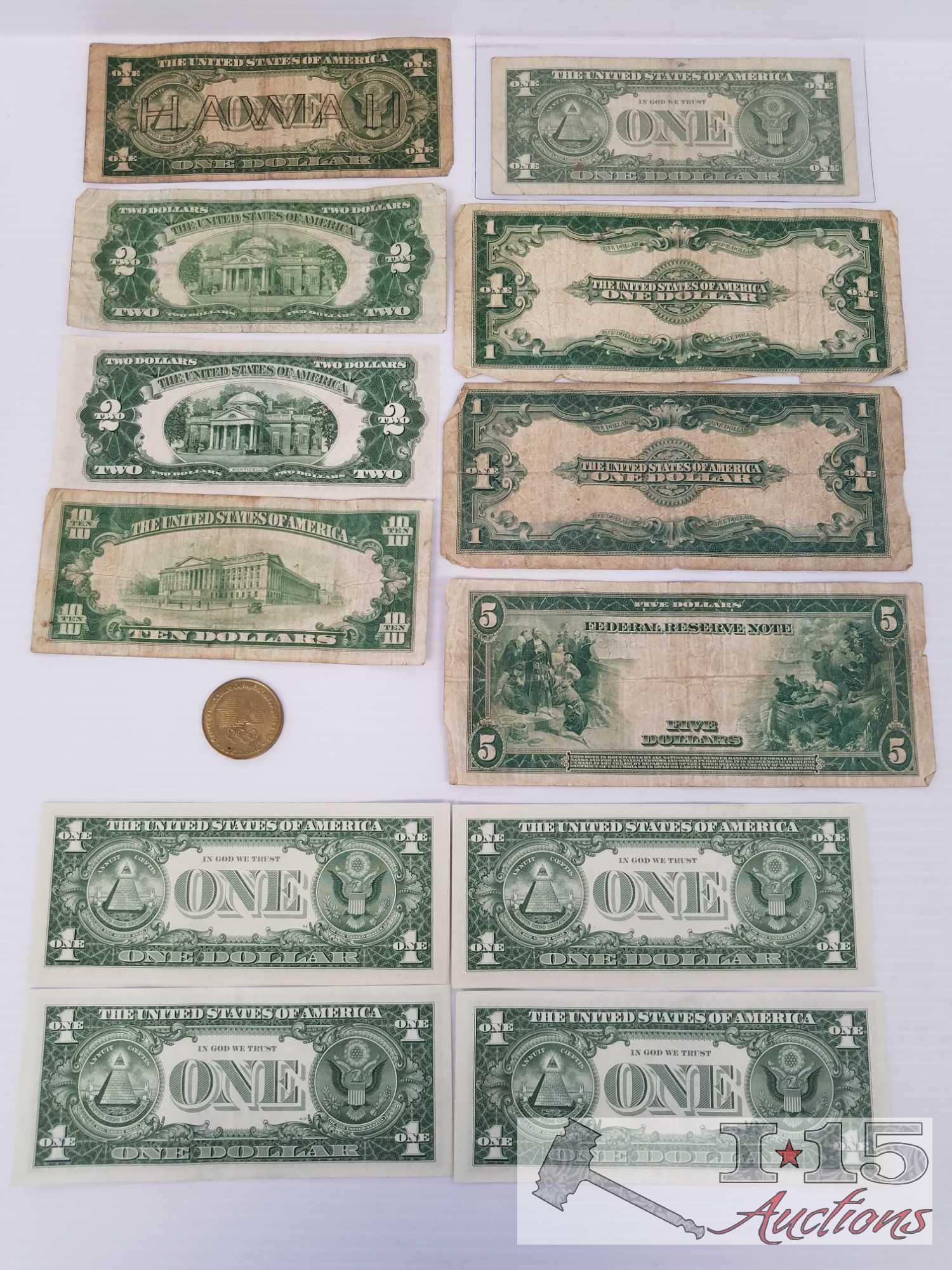 Old U. S. Paper currency and 1984 Olympic Coin