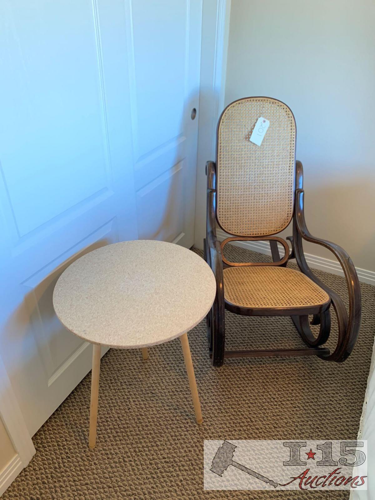 Wooden rocking chair with end table.