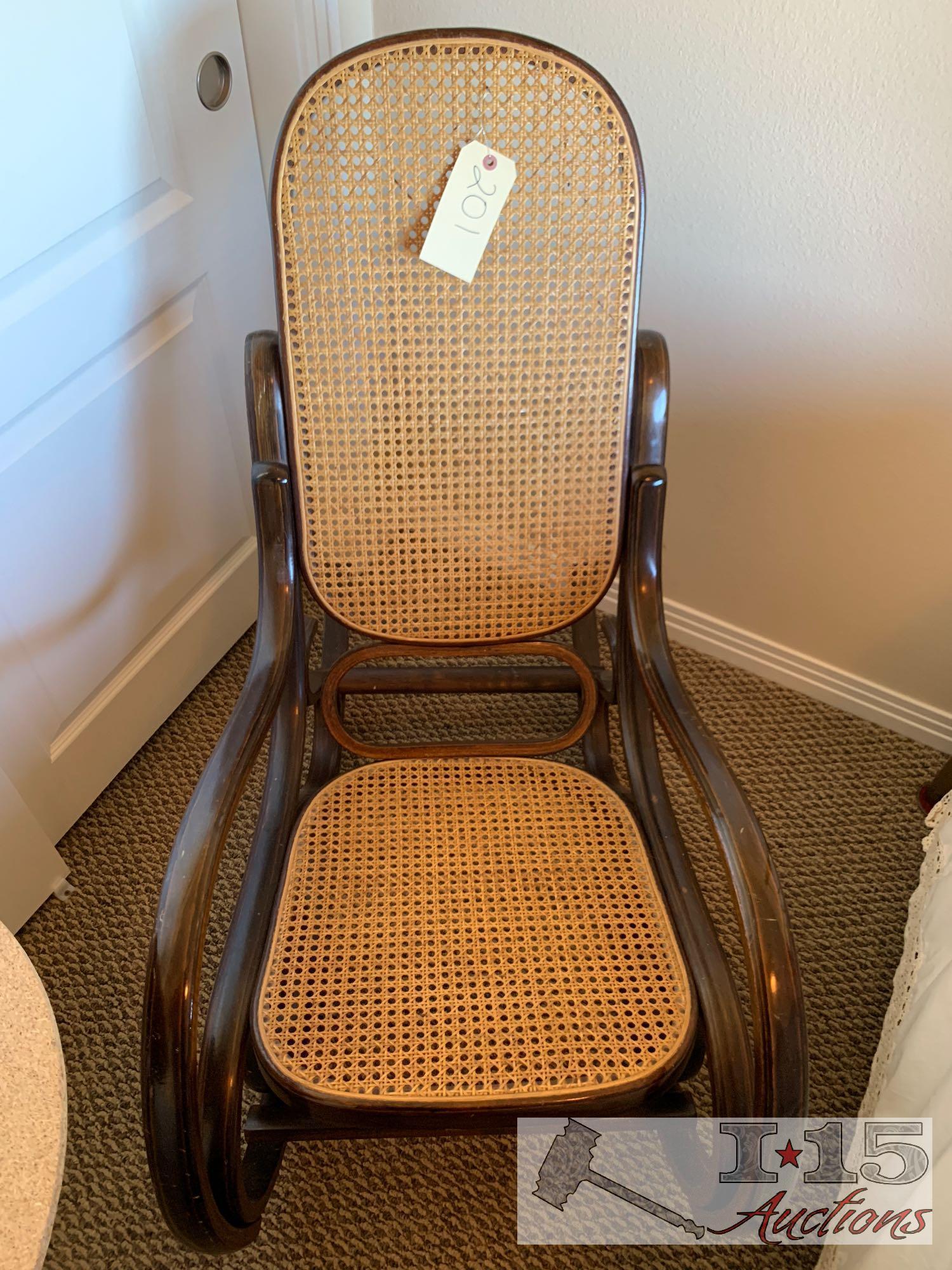 Wooden rocking chair with end table.