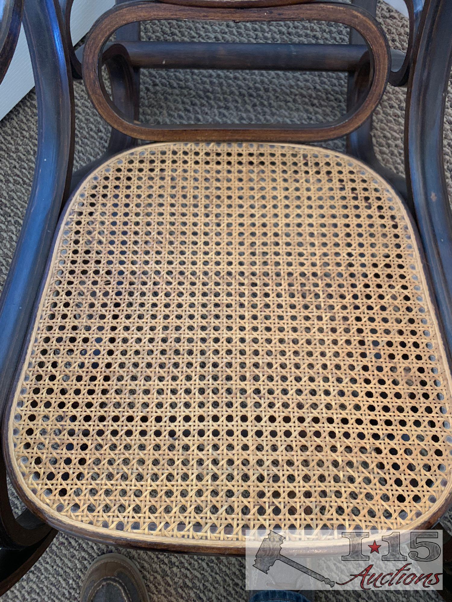 Wooden rocking chair with end table.