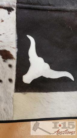 Cowhide rug with longhorn and star design.