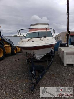 Reinell 247 boat on trailer