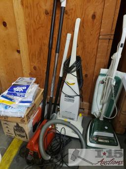 Three Eureka Vacuums, Vacuum Attachments and Vacuum Bags