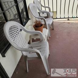 3 White Plastic Chairs, End Table and Pottery