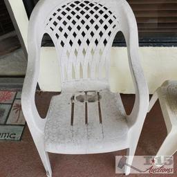 3 White Plastic Chairs, End Table and Pottery