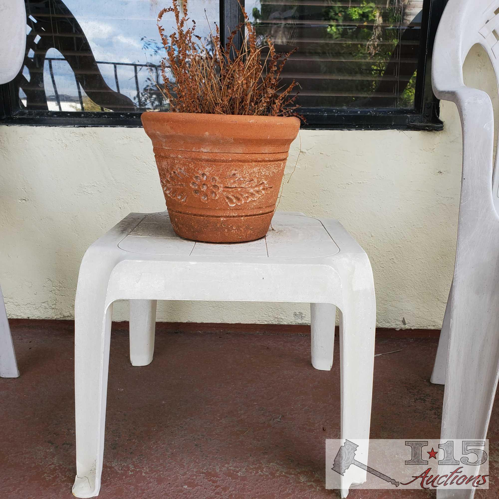 3 White Plastic Chairs, End Table and Pottery