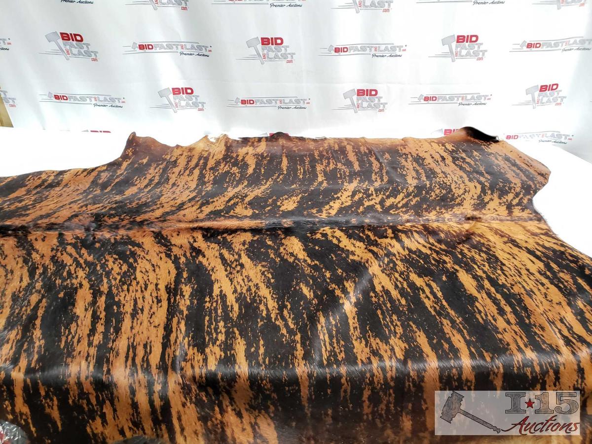 Large Brazilian Brindle hair on cowhide rug. Measures approximately 38-46 square feet.